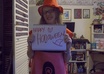 hold a sign with any message of your choice while wearing a gigantic red crayon costume small2