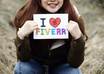 take nice pictures holding a handwritten sign of your website or business at CHERRY blossom field small2