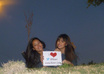 send you 3 photos of me and my twin sister, holding your sign small2
