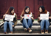 create an  multi exposure photo of me holding your 3 signs small3