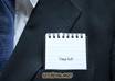 create a picture for you of a Business Man Suite with a message of your choice placed on the sign