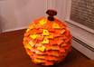 create a decorative pumpkin out of paint chips to get your home ready for Fall