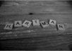 take a high res photo of any word with Scrabble tiles and send it in digital format to use as you please
