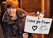 make justin bieber hold up any text or photo you wish e,g Merry CHRISTMAS, Happy Birthday within 24 hours