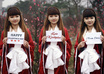 dress up a COSPLAY at cherry blossom field and take nice pictures holding a handwritten sign of your website or business small1