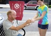 give a sandwhich and a water to a homless