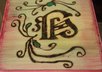 woodburn and paint your initial in calligraphy onto wood