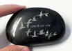 laser engrave your name, text, or line art onto a black stone and MAIL it to you
