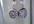 make a pair of  polymer clay chocolate donuts with white icing earrings